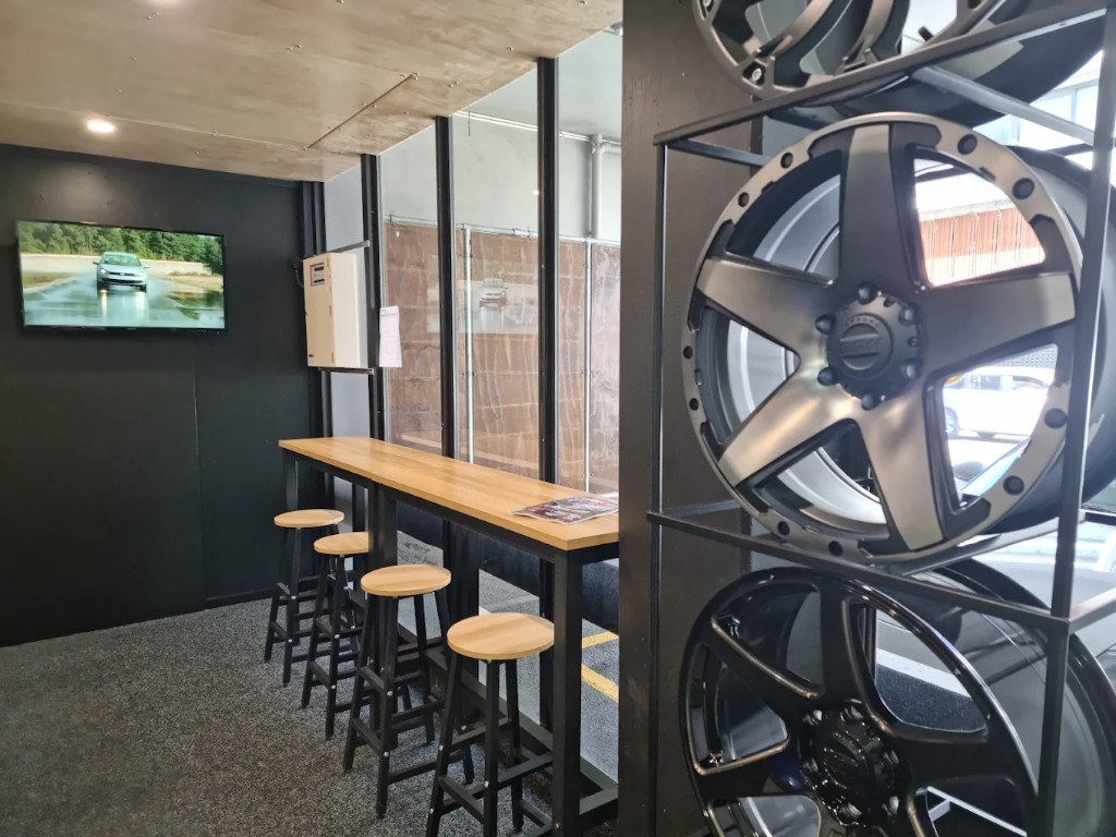 Customer lounge and wheel display at The Tyre Clinic Wellington